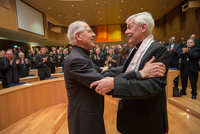 Former Fr. Adolfo Nicolás, SJ (left), embraces newly elected Superior General, Fr. Arturo Sosa, SJ. Outgoing Superior General Fr. Adolfo Nicolás, SJ (left), embraces the newly elected Superior General, Fr. Arturo Sosa, SJ.