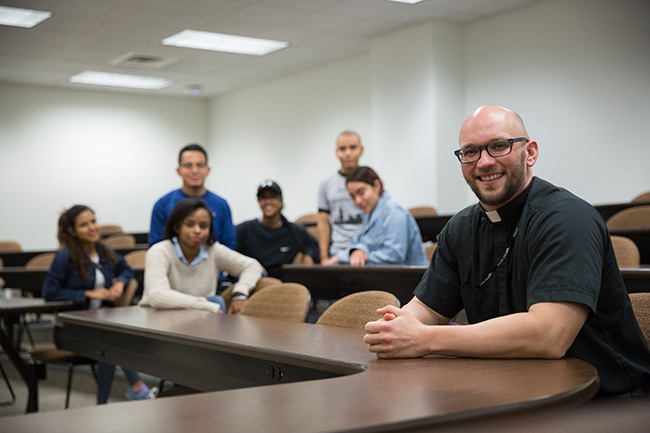 Eric Immel, SJ, with members of the student government at Arrupe College in Chicago. 