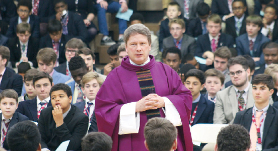 Fr. Brian Lehane, SJ, celebrates Mass with students at the Univestiy of Detroit Jesuit High School and Academy.