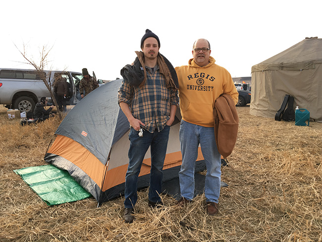 Dr. Michael Schuck (right) with his son Franz at Oceti Sakowin Camp