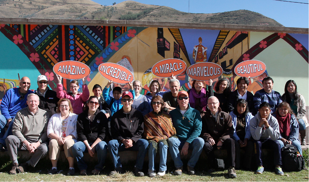 The International Sharing Committee at St. Joseph Catholic Church in Libertyville, Illinois, traveled to Peru with Bill Burke (first row, left), a regional director for advancement for the Midwest Jesuits. Jo Anne Coughlin (front row, center), created a video featuring signs that captured the spirit of the Peruvian people.