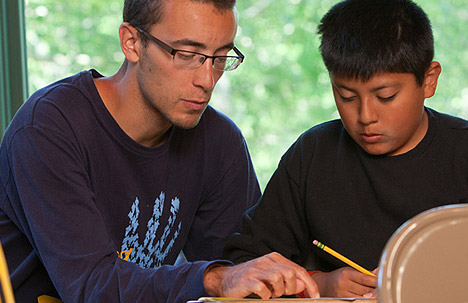 Student and teacher at Nativity Jesuit Middle School